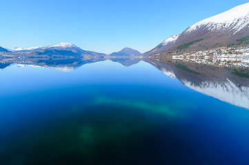 Image showing Serene winter morning over the sea in a mountainous region