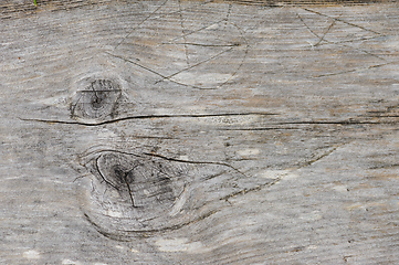 Image showing Close-up view of weathered wooden planks with visible knots and 
