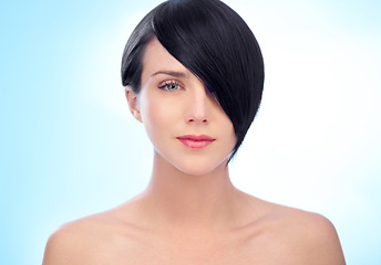 Image showing Beauty, hair care or portrait of model in studio for keratin growth, healthy natural shine or wellness. Face, results or confident woman in spa or salon for hairstyle grooming on blue background