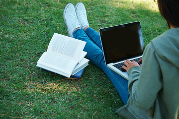 Image showing Study, book and person with laptop in park on campus for research, report and education at college. University, student and girl typing on computer with analysis of philosophy or reading on grass