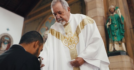 Image showing Religion, church and man with priest for communion for ceremony, service and sermon at altar. Catholic, praying and pastor with wine and biscuit for male person in chapel for ritual, mass and worship