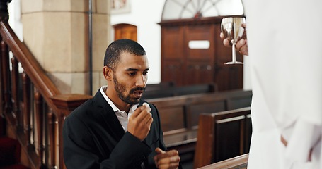 Image showing Religion, church and man with priest for communion for ceremony, service and sermon at altar. Catholic, praying and pastor with wine and biscuit for male person in chapel for ritual, mass and worship