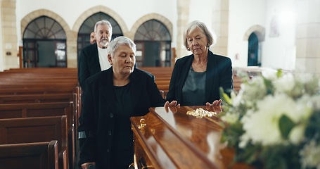 Image showing Senior women, coffin and funeral in church for memory, support and condolences with religion with family. Community, friends and together for death, loss and service with empathy, faith and casket