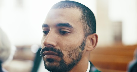 Image showing Sad, man and face closeup with depression at a funeral in church for religious service and mourning. Grief, male person and burial with death, ceremony and grieving loss at chapel event in a suit