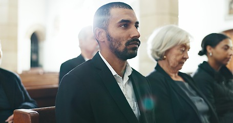 Image showing Sad, man and face closeup with depression at a funeral in church for religious service and mourning. Grief, male person and burial with death, ceremony and grieving loss at chapel event in a suit