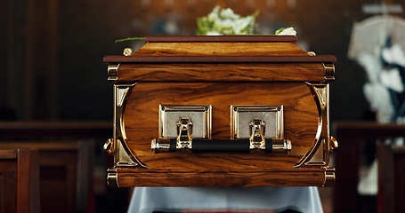 Image showing Casket, church and funeral with service in closeup, zoom or event to celebrate life, worship or faith. Wood coffin, burial and memory in death, mourning or compassion for farewell, temple or religion