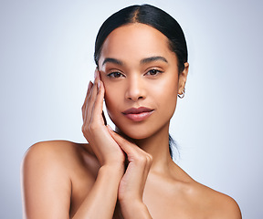 Image showing Self determined worth. a beautiful young woman posing against a grey background.