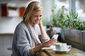 Image showing Phone, happy and woman with drink in coffee shop online for social media, text message and internet. Restaurant, cafe and person on smartphone laugh for website, reading blog and chat with cappuccino