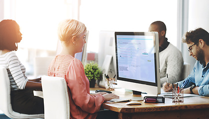 Image showing Group, business people or work on computer in office, diversity or typing or reading of online application. Workplace, productivity or consultants by desktop on research or website for connectivity