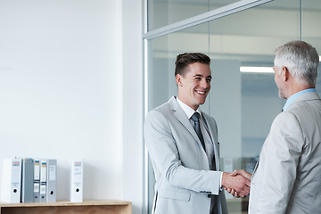 Image showing Businessman, smile and shaking hands with CEO, manager and suit for deal or promotion. Man, consult and hand for contract agreement, interview and leadership for agency and office partnership