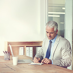 Image showing CEO, businessman and writing with laptop, plan and vision for expanding office and boardroom. Executive, senior employer and diary notes at desk, company and thinking for of new idea in firm project