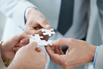 Image showing Business people, puzzle and hands for teamwork, synergy and problem solving in corporation. Professional colleagues, jigsaw and collaboration with strategy for partnership, support and development