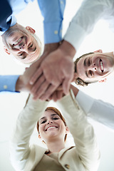 Image showing Low angle, business people and portrait with hands, stack and partnership with cooperation. Face, group and manager with employees or huddle with team building or collaboration for a project or ideas