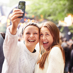 Image showing Friends, women and selfie and music festival for happy memory and social media outdoor at event. Excited people in a profile picture or photography at concert, event or holiday party for celebration