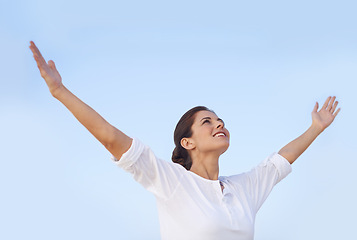 Image showing Woman, freedom and happy outdoor with blue sky, arms out for worship or gratitude in nature. Praying, mindfulness and smile with wellness, healing and care free, faith or spiritual for peace of mind