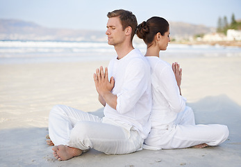 Image showing Couple, yoga and beach with meditation, peace and sitting on sand in morning with mindfulness in summer. Man, woman and outdoor for namaste with spiritual growth, balance or zen by ocean in Cape Town