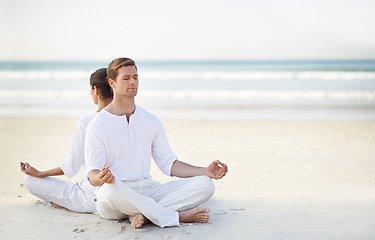 Image showing Couple, yoga and sea with meditation, sand or waves with sitting in morning for mindfulness with space. Man, woman and peace for namaste with spiritual growth, balance and zen at beach in Cape Town