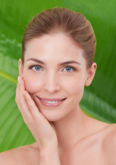 Image showing Woman, skincare and portrait with leaves, palm tree and sustainability for organic cosmetics. Girl, person or model with plants for wellness, touch or glow with dermatology for facial skin for beauty