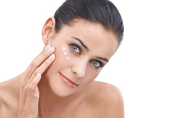 Image showing Happy woman, portrait and skincare with lotion, cosmetics or face cream on a white studio background. Face of female person, brunette or model applying creme or moisturizer for healthy skin on mockup