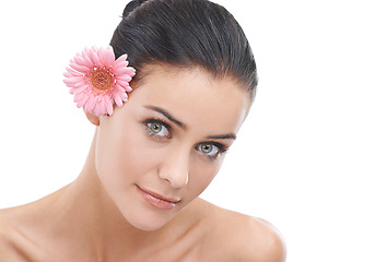 Image showing Woman, portrait and flower with natural beauty for skincare or cosmetics on a white studio background. Face of female person, brunette or model with smile in satisfaction for healthy skin on mockup