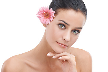 Image showing Woman, portrait and flower for skincare in studio with beauty, floral cosmetics or dermatology. Face of a young model or person with pink daisy for makeup with creative or scent on a white background