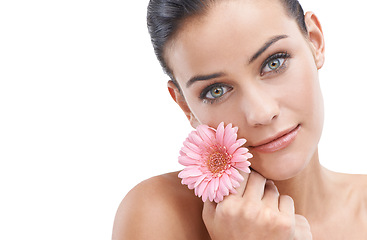 Image showing Woman, portrait and flower for beauty in studio with skincare, floral cosmetics or dermatology. Face of a young model or person with pink daisy for makeup with creative or scent on a white background