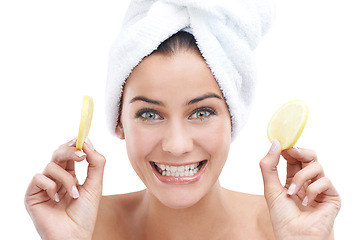 Image showing Woman, skincare and lemon with happy portrait for facial beauty, cosmetics and natural wellness in studio. Face of a young model and fruits with dermatology, makeup and towel on a white background