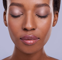 Image showing Skin, face and makeup, black woman with beauty and healthy glow, natural cosmetics for wellness on grey background. Eyeshadow, peace and calm for dermatology, antiaging and skincare in studio