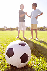 Image showing Soccer, friends and team handshake on grass, agreement and partnership on football field. Children, boys and support in meeting for sports game, welcome and motivation at stadium or respect at park