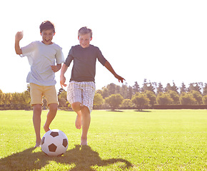 Image showing Soccer, friends and happy for playing on grass, support and smiling for sports game on field. Boys, children and performance on outdoor pitch, bonding and laughing for competition or challenge