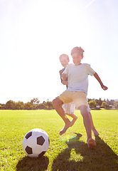 Image showing Soccer, friends and playing for fun on grass, support and smiling for sports game on field. Happy boys, children and performance on outdoor pitch, bonding and laughing for competition or challenge