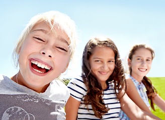 Image showing Children, friends and portrait with smile or outdoor in summer on holiday or sunshine, school or break. Girls, student group and face in nature or relax travel or together for bonding, weekend or fun