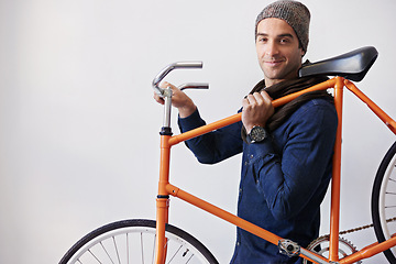 Image showing Man, studio and bike for eco friendly, portrait and transportation on white background. Hipster cyclist, carbon neutral and sustainability travel for environmental commute or fitness and trip