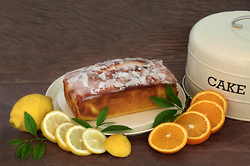 Image showing Lemon and Orange Drizzle Cake with Fresh Fruit