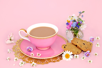 Image showing Cup of Tea with Chocolate Chip Cookies and Spring Flowers  