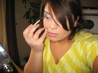 Image showing applying makeup