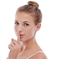 Image showing Woman, portrait and finger for privacy in studio, quiet and confidential information or news. Female person, shush and silent emoji for gossip or drama, secret and whisper icon on white background