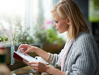 Image showing Coffee shop, reading and woman with book by window with caffeine drink, cappuccino and latte. Cafeteria, restaurant and happy person with story, literature and novel for relaxing, learning and hobby