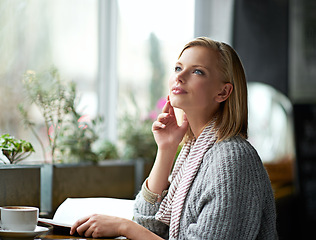 Image showing Coffee shop, thinking and woman with books by window with caffeine drink, cappuccino and latte. Cafeteria, restaurant and happy person with story, literature and novel for relaxing, reading and hobby