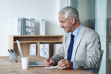 Image showing Man, boss and notes while working on laptop, coffee and office for stakeholder budget account. Senior, manager and indoors for company, book and writing in diary at desk preparing for meeting