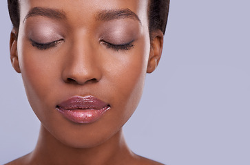 Image showing Skincare, face and makeup, black woman with beauty and healthy glow, natural cosmetics for wellness on grey background. Eyeshadow, peace and calm for dermatology, antiaging and mockup space in studio