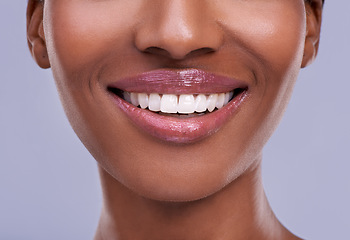 Image showing Teeth whitening, dental and woman with beauty and health, oral hygiene and wellness with smile closeup on grey background. Mouth, lips and lipstick with orthodontics for veneers, cosmetics and skin