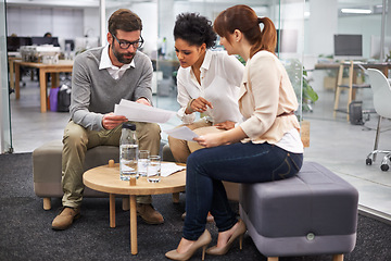 Image showing Business people, documents and meeting at office for schedule planning, financial report or collaboration. Group of employees with paperwork in teamwork for finance, budget or accounting at workplace