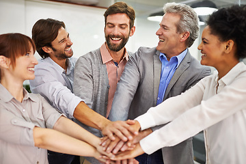 Image showing Collaboration, smile and business people with hands in huddle at office for meeting, motivation or support. Teamwork, goals and target with happy employee group in workplace for celebration of bonus