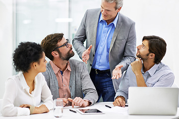 Image showing Businesspeople, mentor and laptop for teamwork or training at tech startup for collaboration, project planning or decision. Men, woman and talking in boardroom or tablet for online, research or email