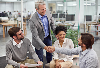 Image showing Business people, handshake and meeting with team for partnership, b2b or agreement at office. Businessman or employees shaking hands for greeting, deal or collaboration in discussion at workplace