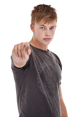 Image showing Man, portrait and pointing in studio for selection, opinion and confidence for choosing you. Male person, serious face and proud of decision on white background, emoji and vote for opportunity