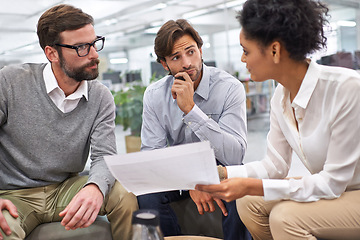 Image showing Business people, documents and thinking in meeting, decision or schedule planning at office. Group of employees with paperwork in teamwork, finance or budget for financial plan or choice at workplace