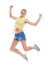 Image showing Excited, jump or portrait of girl teenager in studio for news, announcement or bonus prize. Energy, smile or happy model winner in celebration of fashion discount, success or sale on white background