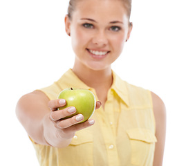 Image showing Hand, apple or portrait of happy woman giving a healthy choice isolated on white background. Nutrition vitamins, smile or female person in studio with fruit or offer for fiber, detox diet or wellness